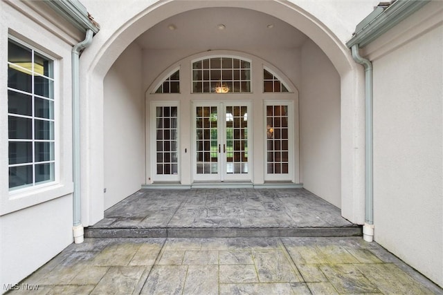 doorway to property with a patio and french doors