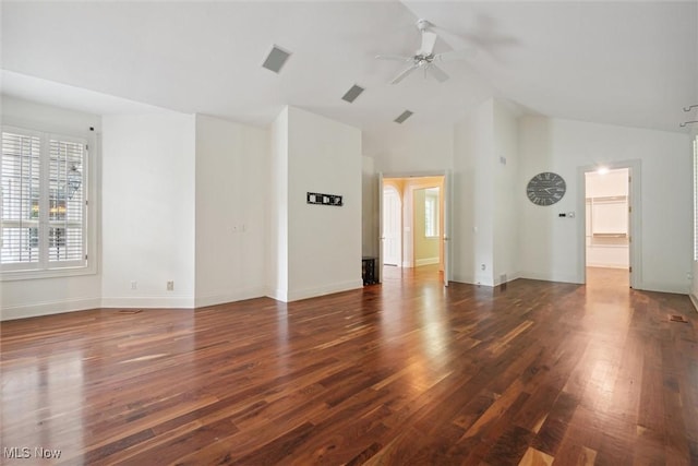 spare room with ceiling fan, dark wood-type flooring, and high vaulted ceiling