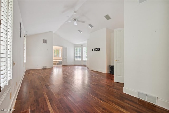 unfurnished living room featuring high vaulted ceiling, dark hardwood / wood-style floors, and ceiling fan