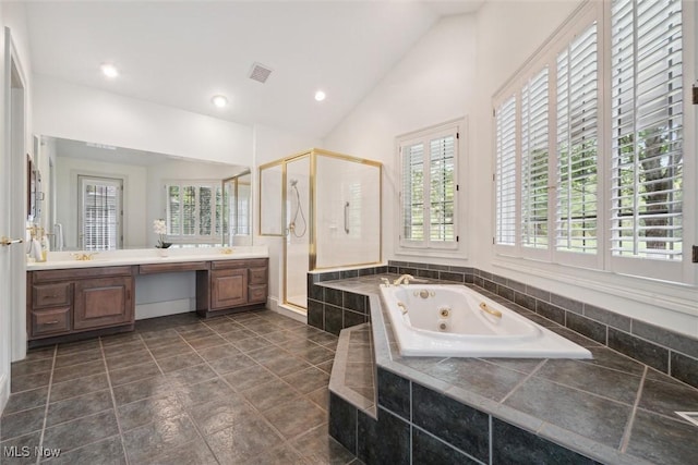 bathroom with vanity, independent shower and bath, and lofted ceiling