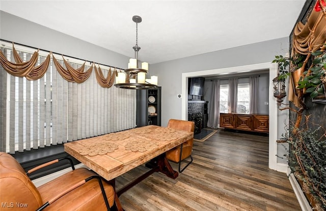 dining area with dark hardwood / wood-style flooring