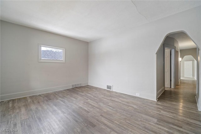 spare room featuring hardwood / wood-style floors