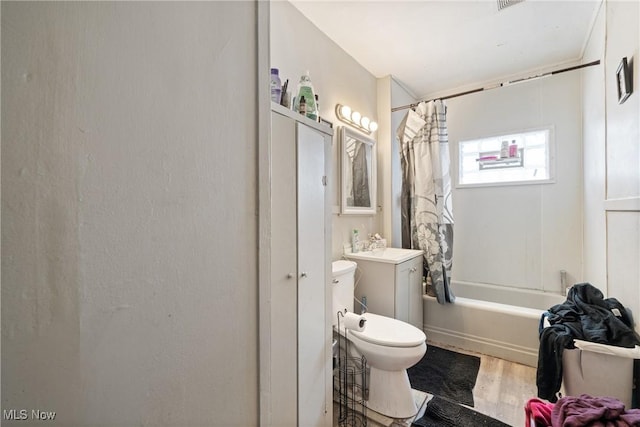 full bathroom with shower / bathtub combination with curtain, vanity, toilet, and hardwood / wood-style floors