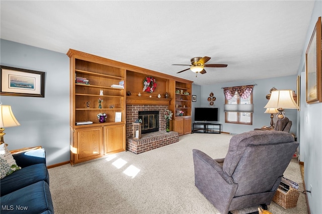 living room featuring ceiling fan, a brick fireplace, and light colored carpet