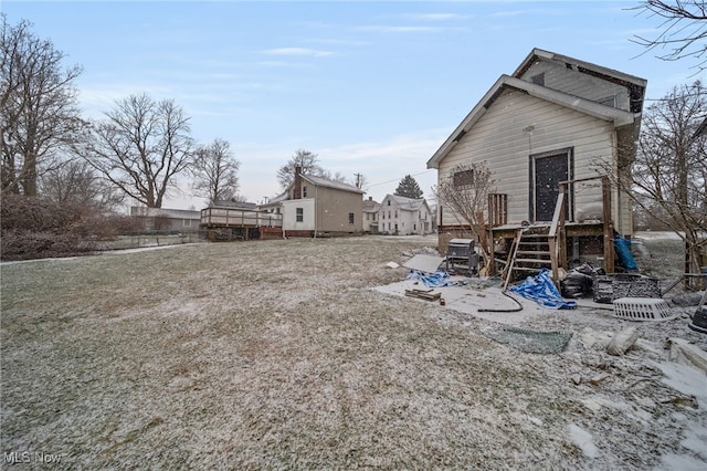 back of house with a wooden deck