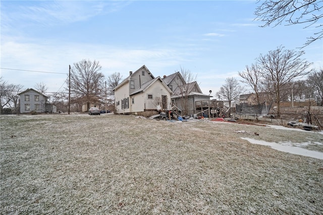 view of side of home featuring a lawn