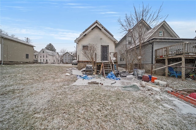 back of property featuring a wooden deck