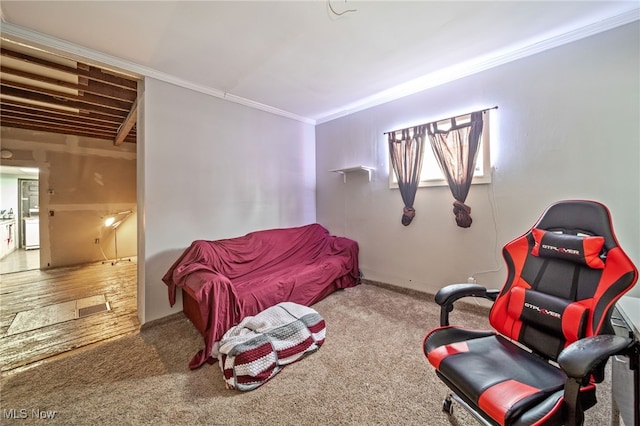 sitting room featuring carpet and crown molding