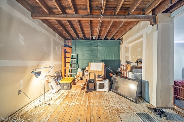 basement featuring hardwood / wood-style flooring