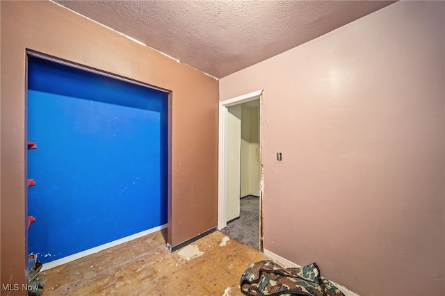 spare room featuring a textured ceiling