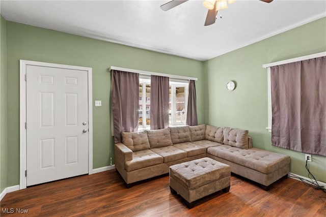 living room with ceiling fan and dark hardwood / wood-style floors