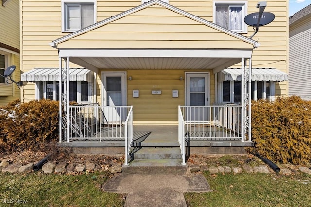 entrance to property with covered porch