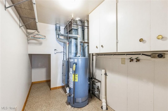 utility room featuring gas water heater