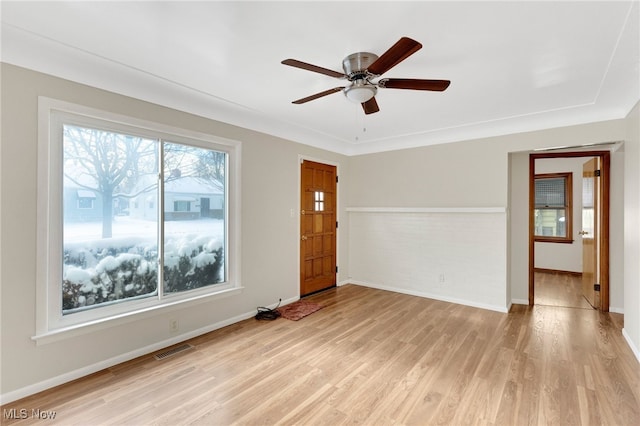 unfurnished room featuring ceiling fan and light hardwood / wood-style floors