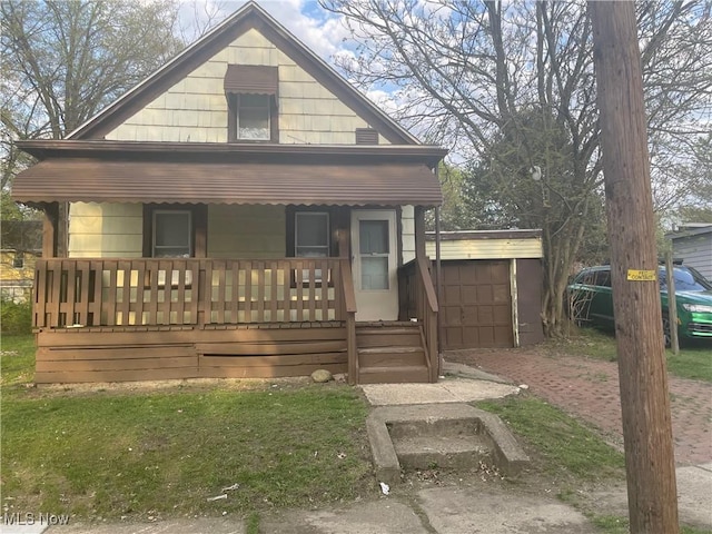 847 Sherman St, Akron, OH 44311 - view of front of house with covered porch and an outbuilding