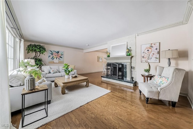 living room with ornamental molding and wood-type flooring