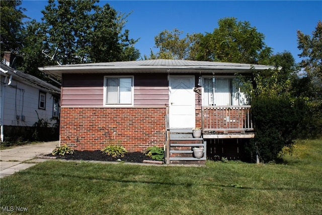 bungalow with a front yard