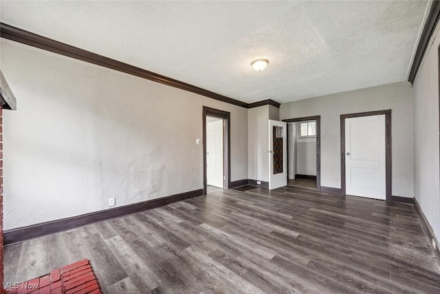 unfurnished bedroom featuring a textured ceiling and dark wood-type flooring