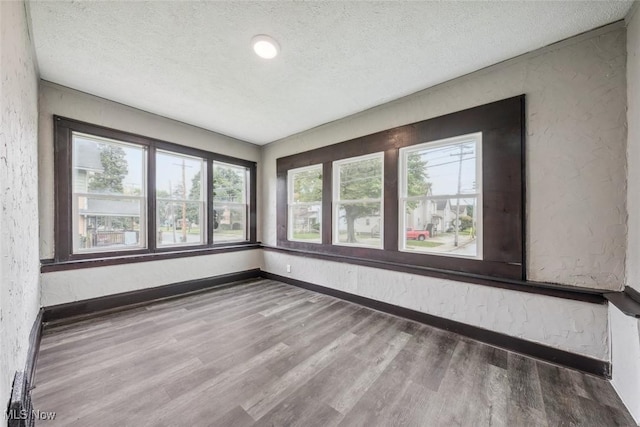 unfurnished sunroom with a wealth of natural light