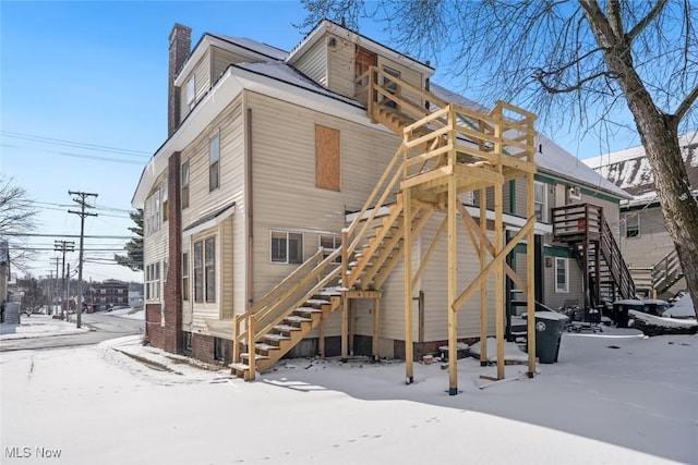 view of snow covered house