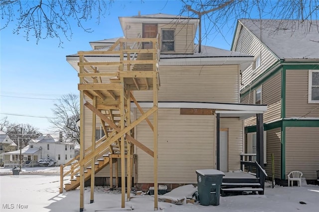 view of snow covered house