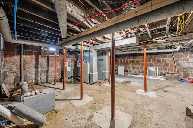 basement featuring heating unit and water heater