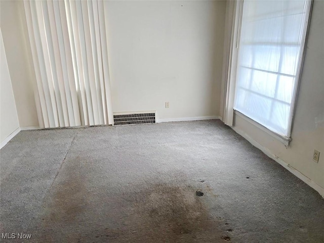 unfurnished room with carpet flooring