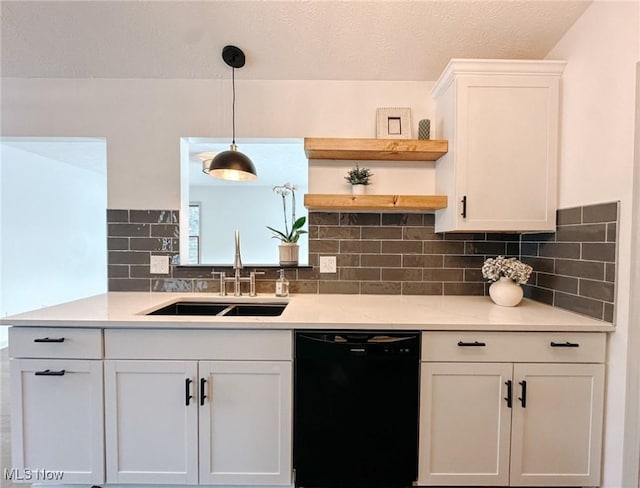 kitchen with sink, white cabinetry, dishwasher, pendant lighting, and light stone countertops