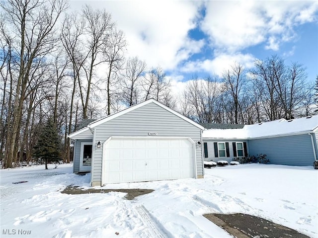 view of snow covered garage