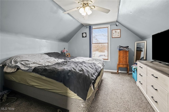 bedroom with lofted ceiling, dark colored carpet, and ceiling fan