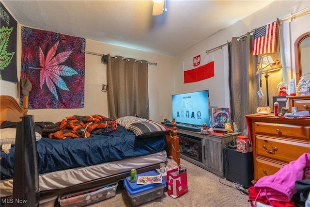 carpeted bedroom with ceiling fan