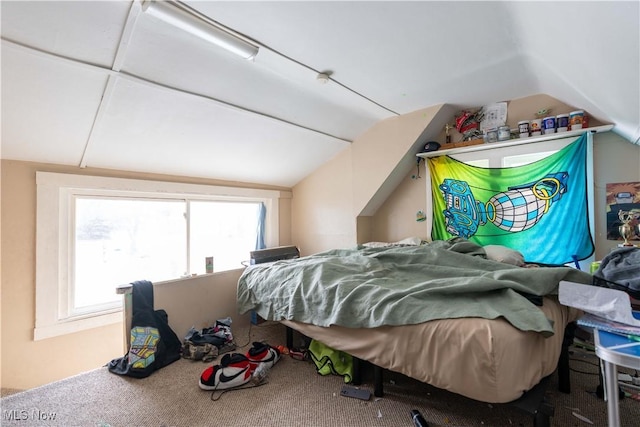 carpeted bedroom featuring lofted ceiling