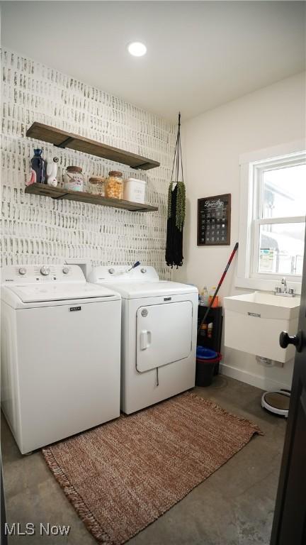 laundry room with sink and separate washer and dryer