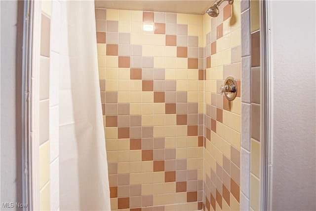 details with a tile shower