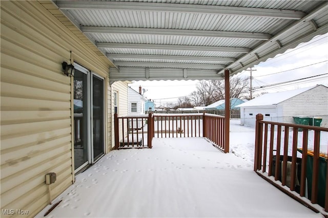 view of snow covered deck