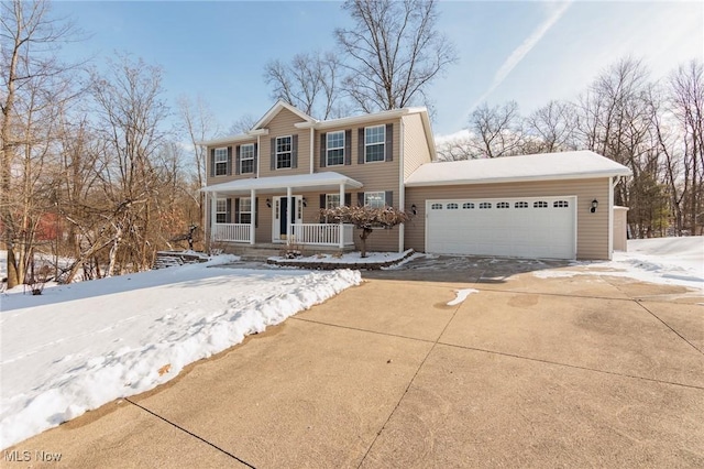 view of front of property featuring a garage and covered porch