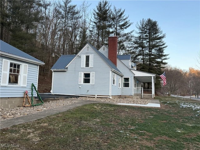 back of property featuring a porch