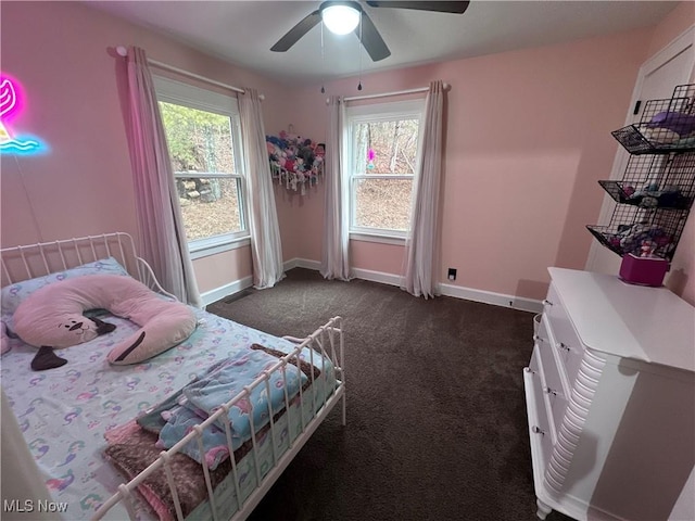 bedroom featuring ceiling fan and dark colored carpet