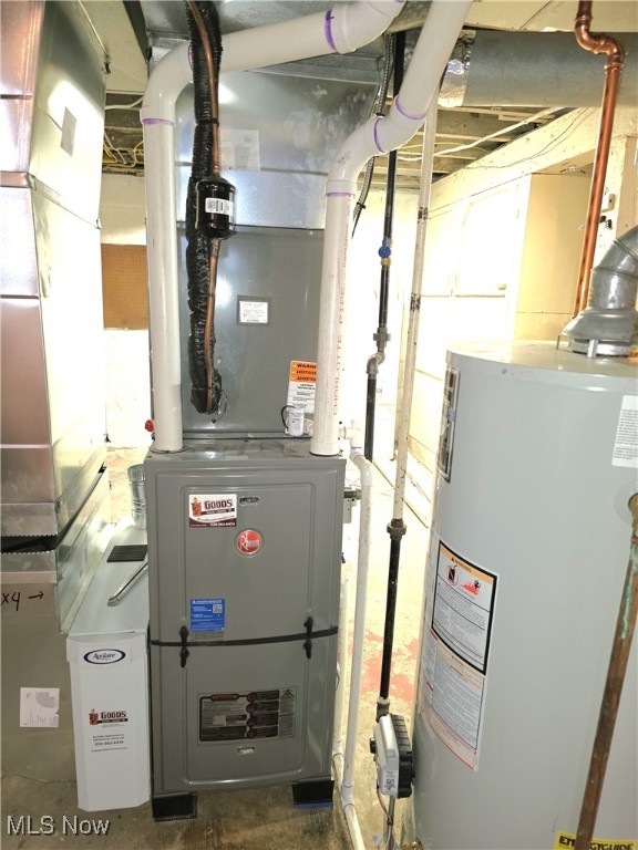 utility room with gas water heater