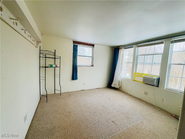 spare room with carpet floors and cooling unit