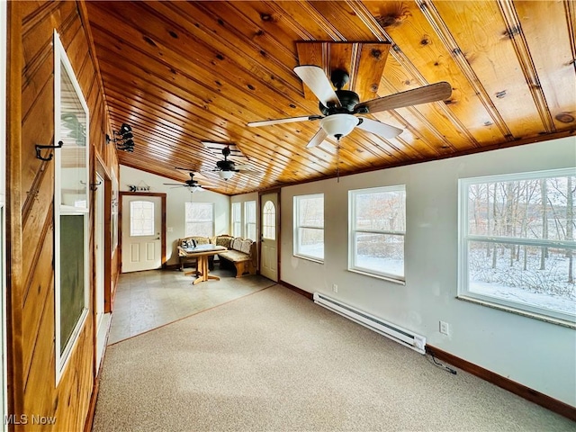 unfurnished sunroom featuring wooden ceiling, vaulted ceiling, baseboard heating, and a wealth of natural light