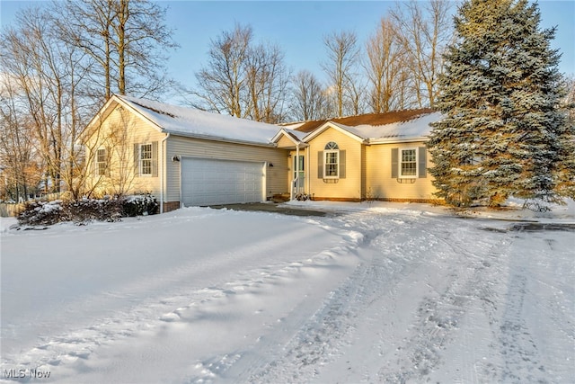 single story home featuring a garage