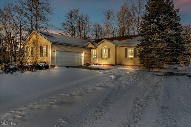 single story home with a garage