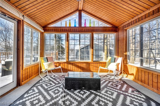 sunroom / solarium featuring vaulted ceiling and wooden ceiling