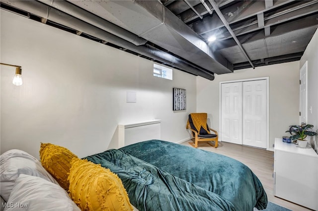 bedroom featuring a closet and hardwood / wood-style floors