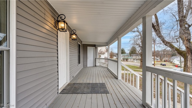 wooden terrace with a porch