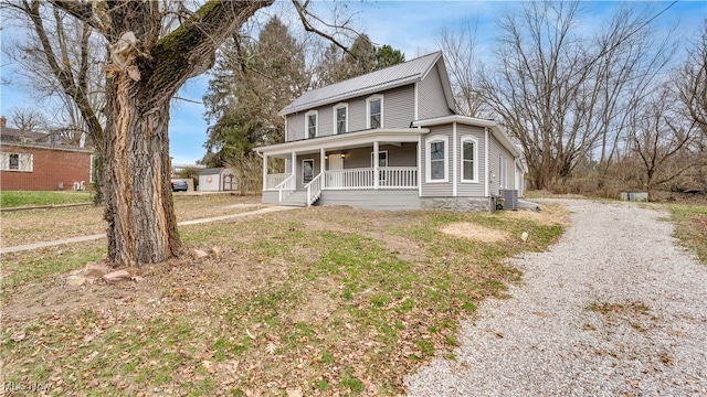 country-style home with covered porch and central AC