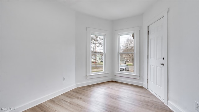 unfurnished room featuring light wood-type flooring