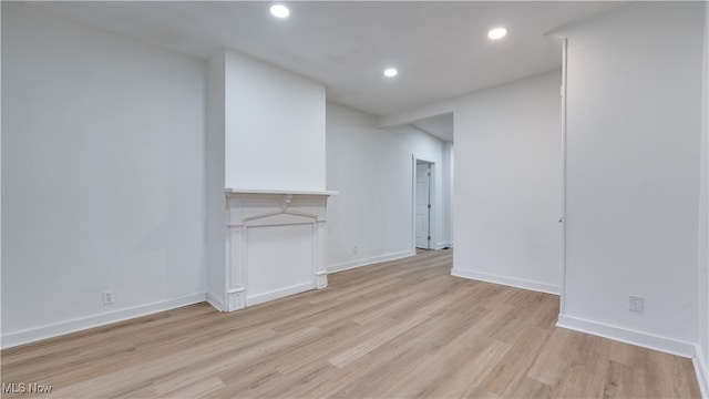 unfurnished living room featuring light wood-type flooring