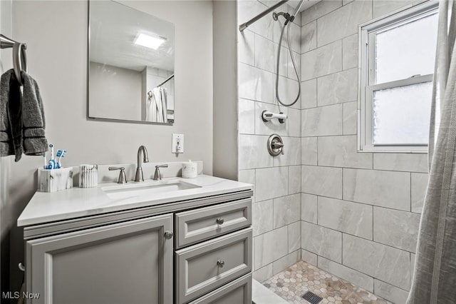 bathroom featuring vanity and walk in shower